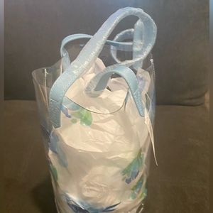 Blue Floral Clear Tote Bag with blue handles.